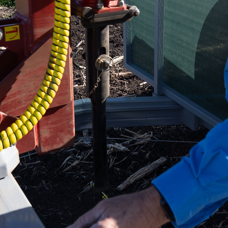 Agronomist taking a soil core sample in a paddock near Toowoomba for agricultural soil testing